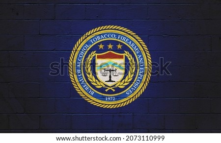The ATF (Bureau of Alcohol, Tobacco, Firearms and explosives) painted on a brick wall. Royalty-Free Stock Photo #2073110999