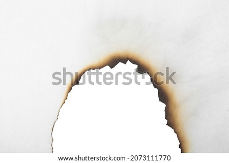 Burnt white paper close-up. Burnt paper texture.
