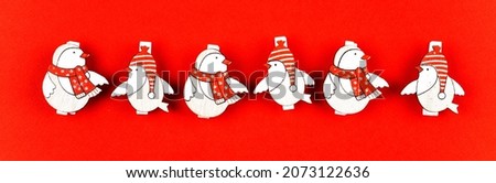 Festive Christmas mockup on red background with copy space for text and winter birds. Copy space. Elegant birds are in a row. New Year 2022