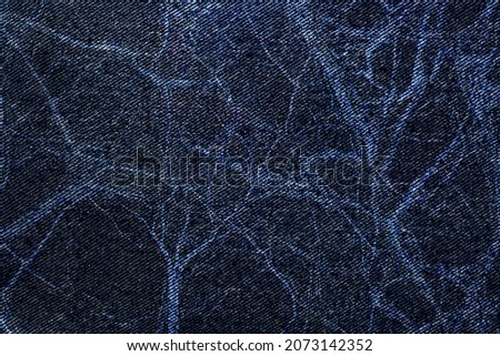 Denim jean Classic canvas cloth texture with Psychedelic Pattern. Denim jeans fabric with marble stone patterns. Raw colorful jeans denim background. Royalty-Free Stock Photo #2073142352