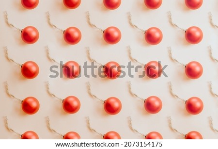 Beautiful christmas banner background with minimal pattern, red Christmas decoration on bright background modern concept baubles composition, Happy New Year composition. Frame with decorations
