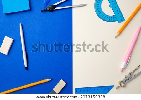 School accessories on blue and white background top view