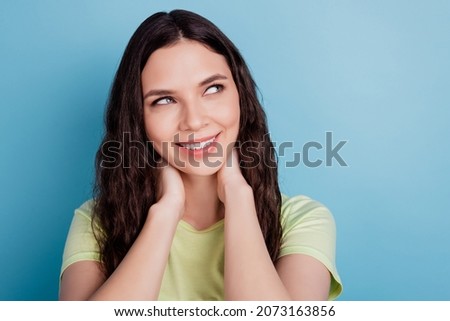 Photo of charming adorable lady hand neck imagine thoughts look blank space dream on blue wall