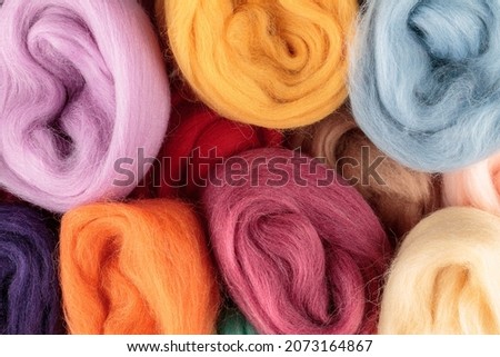 Multi-colored merino wool of high quality, for felting, needlework, knitting, making crafts and clothing, close-up Royalty-Free Stock Photo #2073164867
