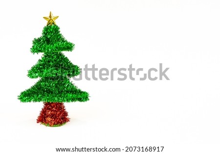 Christmas tree isolated on white background. Christmas shiny tinsel tree decoration on white background, Merry Christmas and Happy New Year. Close up, nobody, copy space for text