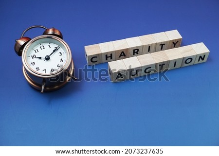 Charity Auction alphabet letter on blue background