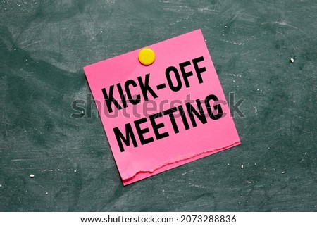 KICK OFF MEETING. blank pink sticker on a green board attached with a round magnet, Royalty-Free Stock Photo #2073288836