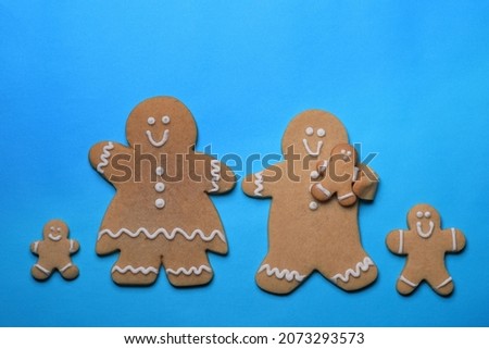 Happy GingerBread People on Blue Background