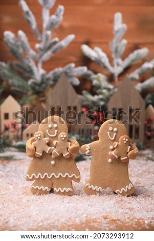 Happy Gingerbread Family Enjoying the Christmas Holiday with their Children
