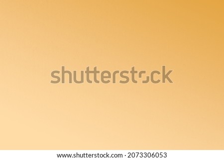Empty soft plain gold yellow color tone gradation blend pale light yellow beige shade on craft cardboard box recyclable paper texture background for website page design or mockup packaging Royalty-Free Stock Photo #2073306053