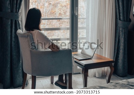 loneliness, lonely woman. Winter depression - seasonal affective disorder mental health woman sad comtemplative looking out the window alone. Depressed woman near window at home Royalty-Free Stock Photo #2073313715