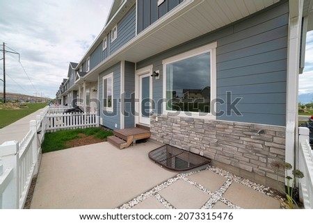 Exterior of a townhouse with bricks and wooden siding at Utah Royalty-Free Stock Photo #2073315476