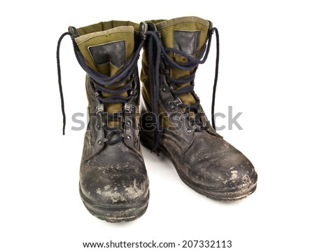 dirty military boots on white background