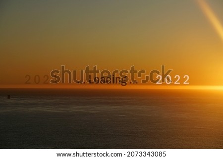 Landscape sunrise morning scene with Loading 2021 to 2022 letters on the Sea twilight color , Eand of year 2021 and Happy new year 2020 concept - abstract background 