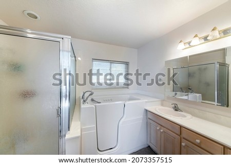 Walk-in bathtub with elderly and handicapped accessibility Royalty-Free Stock Photo #2073357515