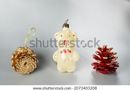 Old retro christmas tree decoration glass toy dog with two pine cones 