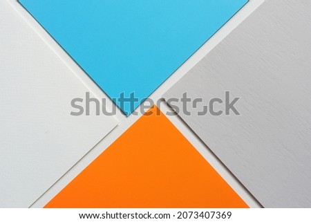 On a white background, an abstract background notion of blue and gray and orange blank paper alignment Royalty-Free Stock Photo #2073407369