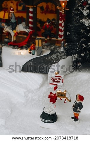 Christmas figures of Elf at the north pole . Famous Lemax toys, Christmas winter gifts and decorations.