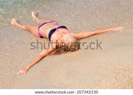 Beautiful young woman relaxing at beach