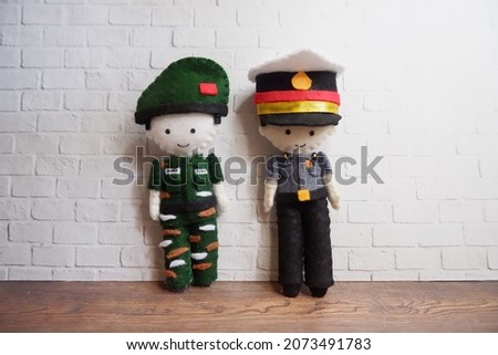 Indonesian police and army character handcrafted dolls from flannel