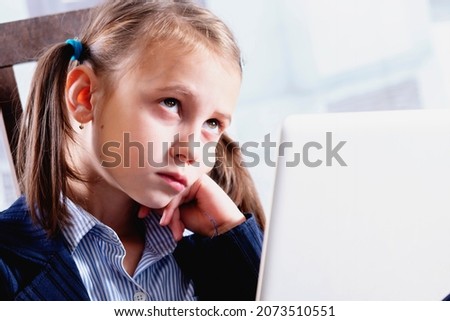 Sad and tired young beautiful  business girl working in office with laptop. 