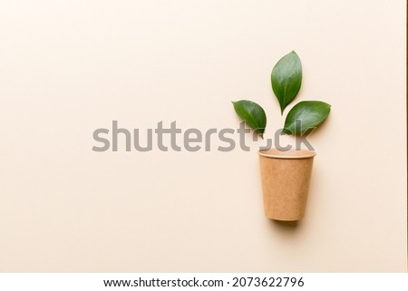 Zero waste cup with green leaf, environmentally friendly, disposable, cardboard, Eco-friendly coffee cup. top View with copy space. Royalty-Free Stock Photo #2073622796
