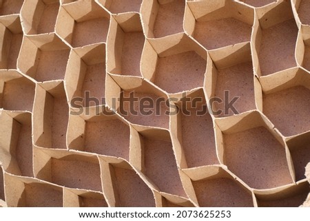 Inside view of a fragile interior cheap door made of fiberboard and chipboard, cells made of fragile cardboard close-up