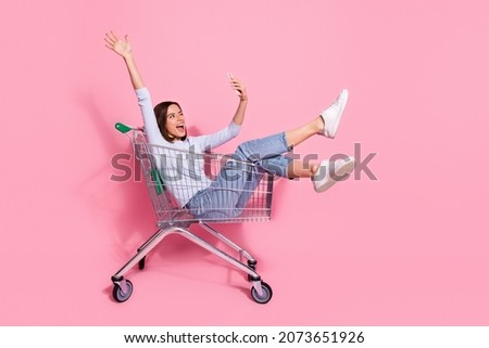 Photo of funky pretty young lady dressed white jumper tacking selfie modern device having fun shopping trolley isolated pink color background Royalty-Free Stock Photo #2073651926