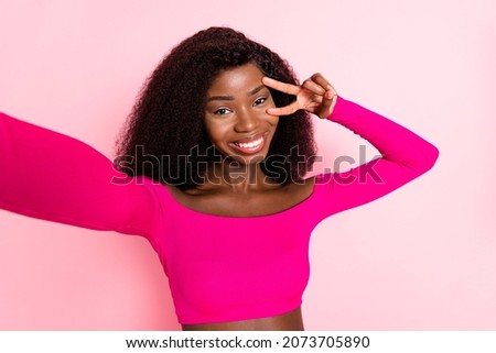 Photo of optimistic brunette nice lady do selfie show v-sign wear pink top isolated on pastel color background