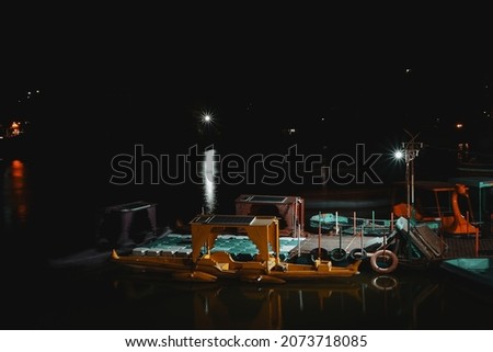 Boats during night in Mount Abu Lake