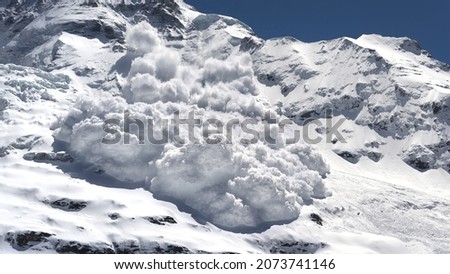 An avalanche is rumbling down a steep mountain slope Royalty-Free Stock Photo #2073741146