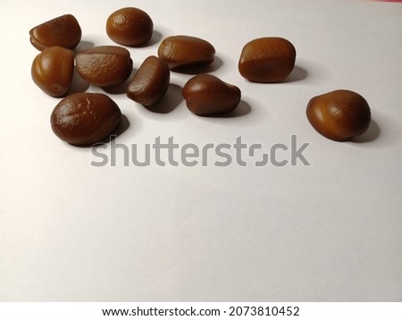 a snakefruit seeds on white background