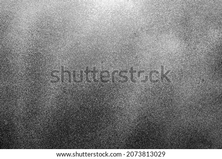 Dark gray black detailed abstract wall surface with grunge texture background pattern.