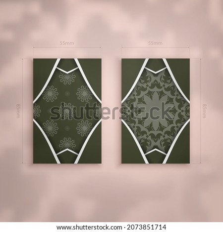 Dark green business card with Greek white ornaments for your personality.