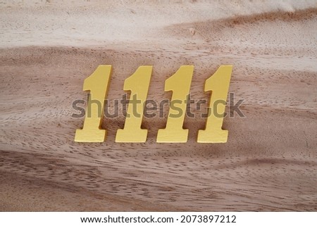  Golden Arabic numerals 1111 on a dark brown to white wood grain background.                              