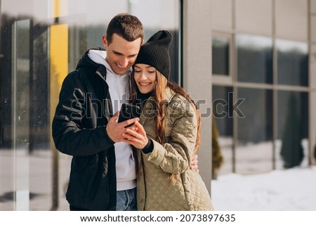 Young couple in love walking in winter time