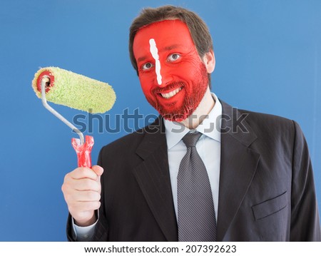 Man ready to brush and paint walls