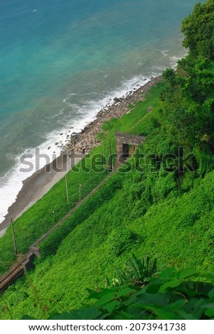 View from the green slope to the sea and the railway