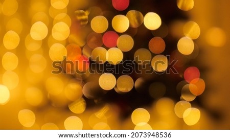 Abstract blurred shot of Christmas lights bokeh blinking and shining. Perfect background for winter holidays.