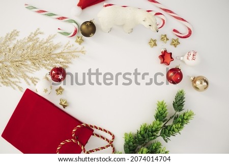 Creative arrangement  with  Christmas decoration  and fir branches on a neutral background. Minimal New Year flat lay.