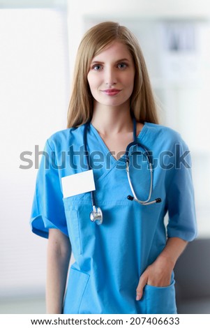 Portrait of woman doctor at hospital corridor
