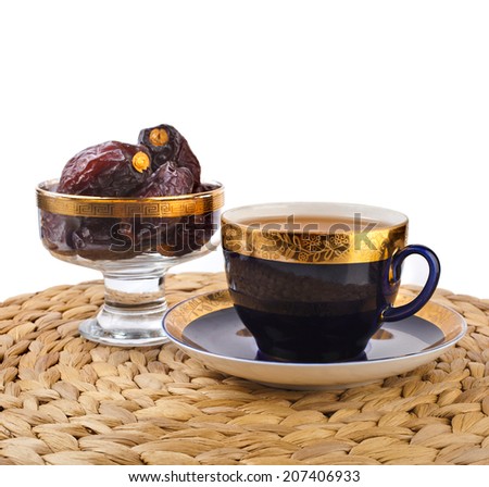 Ramadan eastern refreshment drink with dates on table placemat  isolated  on a white background