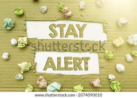 Sign displaying Stay Alert. Concept meaning Paying full attention to things around Quick to see or understand Forming New Thoughts Uncover Fresh Ideas Accepting Changes