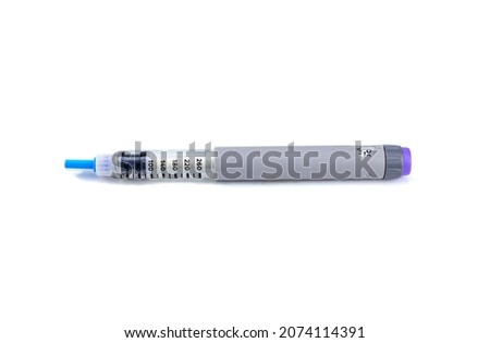 Gray insulin syringe pen on a white background, isolated. Insulin injection pen for hormone therapy Royalty-Free Stock Photo #2074114391