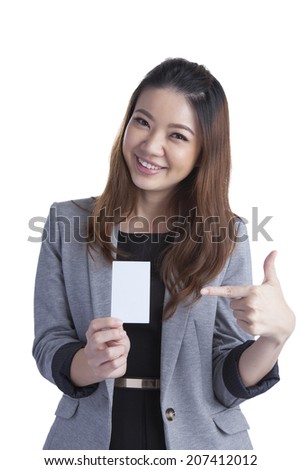 Business card woman. Portrait of a young beautiful businesswoman holding a blank white paper sign. Mixed race chinese / caucasian xwoman isolated on seamless white background.