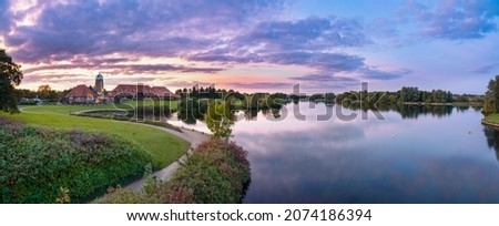 Caldecotte lake sunset panorama in Milton Keynes. England Royalty-Free Stock Photo #2074186394