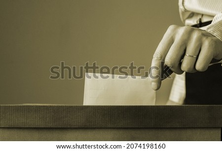 European Union parliament election concept -  hand putting ballot in election box