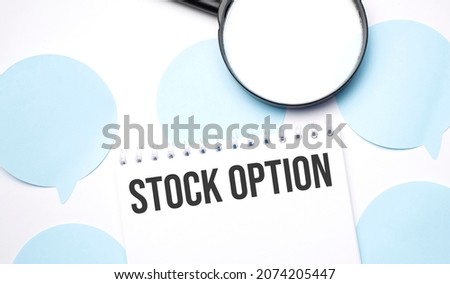 White noteapad and magnifier on blue speech bubles. Text Stock option. Business concept