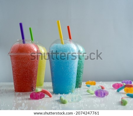 Colored slushies, with ice and gummies Royalty-Free Stock Photo #2074247761
