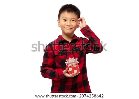 Kid questioning and guessing what inside the gift box isolated on white background